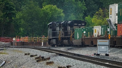 A Norfolk Southern freight train travels through East Palestine, Ohio, June 25, 2024.