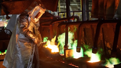 An employee works at Nexans, one of the world's largest wire and cable manufacturers, Friday, April 12, 2024, near Montreal.