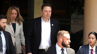Elon Musk, center, arrives for the 10th World Water Forum in Nusa Dua, Bali, Indonesia on Monday, May 20, 2024.