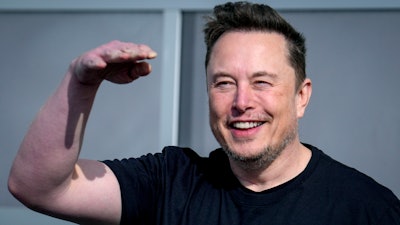 Tesla CEO Elon Musk waves as he leaves the Tesla Gigafactory for electric cars in Gruenheide near Berlin, Germany on March 13, 2024.