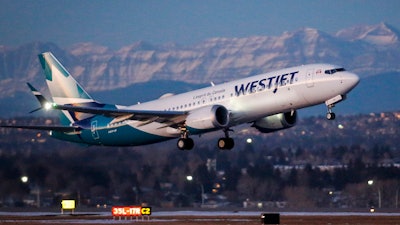 A WestJet airplane takes off in Calgary, Alta., Jan. 21, 202.