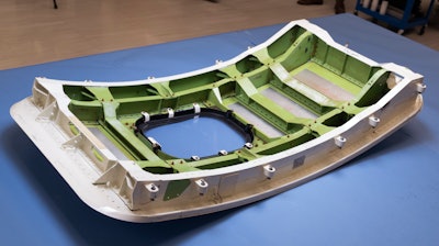 The door plug from the Alaska Airlines Flight 1282's Boeing 737-9 MAX airplane is shown at the National Transportation Safety Board laboratory, in Washington.