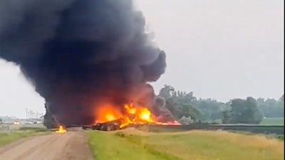 This photo provided by Doug Zink, smoke fills the sky after a train derailment on Friday, July 5, 2024 near Carrington, N.D.