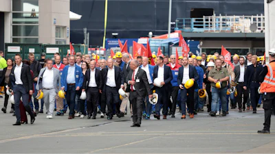 Federal Chancellor Olaf Scholz, front 4th from left, visits the Meyer Werft shipyard in Papenburg, Germany, Thursday Aug. 22, 2024.