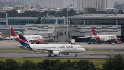 A Latam plane taxis on the runway after landing at El Dorado airport amid jet fuel shortages in Bogota, Colombia.
