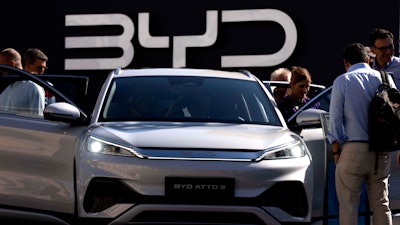 Visitors look at the Chinese made BYD ATTO 3 at the IAA motor show in Munich, Germany, on Sept. 8, 2023.