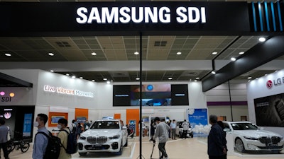 People walk by Samsung SDI Co.' booth during the InterBattery 2021, the country's leading battery exhibition, at COEX in Seoul, South Korea, on June 9, 2021.