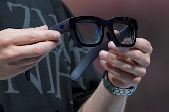Mark Zuckerberg holds a pair of Orion AR glasses during the Meta Connect conference Wednesday, Sept. 25, 2024, in Menlo Park, Calif.