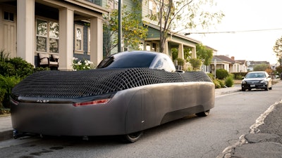 Alef's flying car model parked along the street.