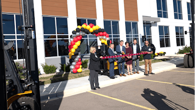Big Lift President Dan Rosskamm (center) prepares to cut the ribbon at the company's new headquarters, DeForest, Wis., Sept. 25, 2024.