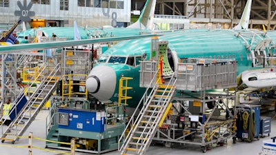 Boeing 737 MAX airplanes are shown on the assembly line during a media tour at the Boeing facility in Renton, Wash., June 25, 2024.