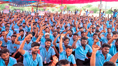 Samsung workers who are on strike shout slogans during a protest near their plant in Sriperumbudur, on the outskirts of Chennai, India, Tuesday, Sept. 24, 2024.
