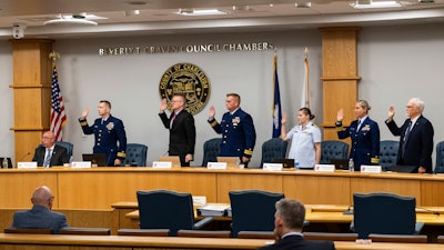 Coast Guard members of the investigative board for the Titan marine board formal hearing take an oath inside the Charleston County Council Chambers Monday, Sept. 16, 2024, in North Charleston, S.C.