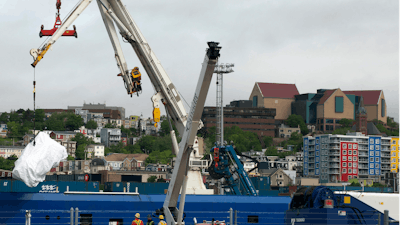 Debris from the Titan submersible, recovered from the ocean floor near the wreck of the Titanic, is unloaded from the ship Horizon Arctic at the Canadian Coast Guard pier in St. John's, Newfoundland, June 28, 2023.