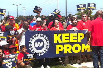 In this image from video, United Auto Workers members rally outside Stellantis' Sterling Heights Assembly Plant Friday, Aug. 23, 2024, in Sterling Heights, Mich.