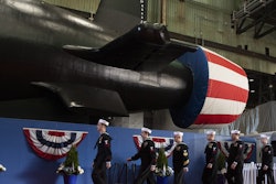 The crew of the pre-commissioning unit (PCU) Idaho (SSN 799) march in formation during a christening ceremony at General Dynamics Electric Boat shipyard facility in Groton, Conn., March 16, 2024.
