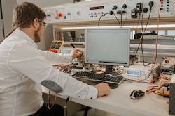 A Collins engineer works in the lab at the company's facility in Nordlingen, Germany.