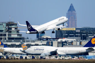 A Lufthansa Airbus takes off at Frankfurt Airport above other passenger aircraft of the airline, Germany, Monday, March 23, 2020.
