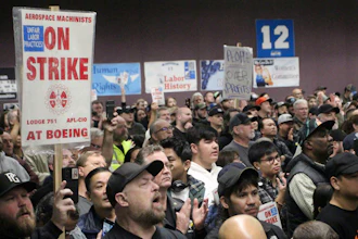 Boeing machinists, labor allies and elected officials rally in Seattle at their union hall on Tuesday, Oct. 15, 2024.