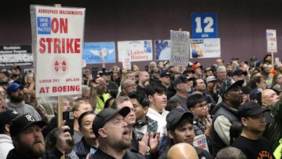 Boeing machinists, labor allies and elected officials rally in Seattle at their union hall on Tuesday, Oct. 15, 2024.