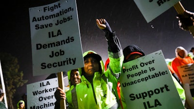 Dockworker Meikysha Wright and others strike outside the Virginia International Gateway in Portsmouth, Va., Tuesday, Oct. 1, 2024.