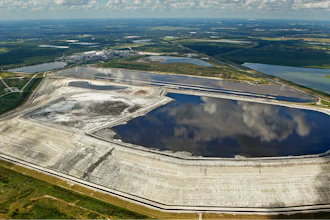 A sinkhole that opened up underneath a gypsum stack at a Mosaic phosphate fertilizer plant is seen in Mulberry, Fla., on Sept. 16, 2016.