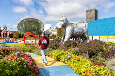 A visitor walks through the outdoor Hasbro Game Park at The Strong National Museum of Play, Tuesday, Oct. 15, 2024, in Rochester, N.Y.