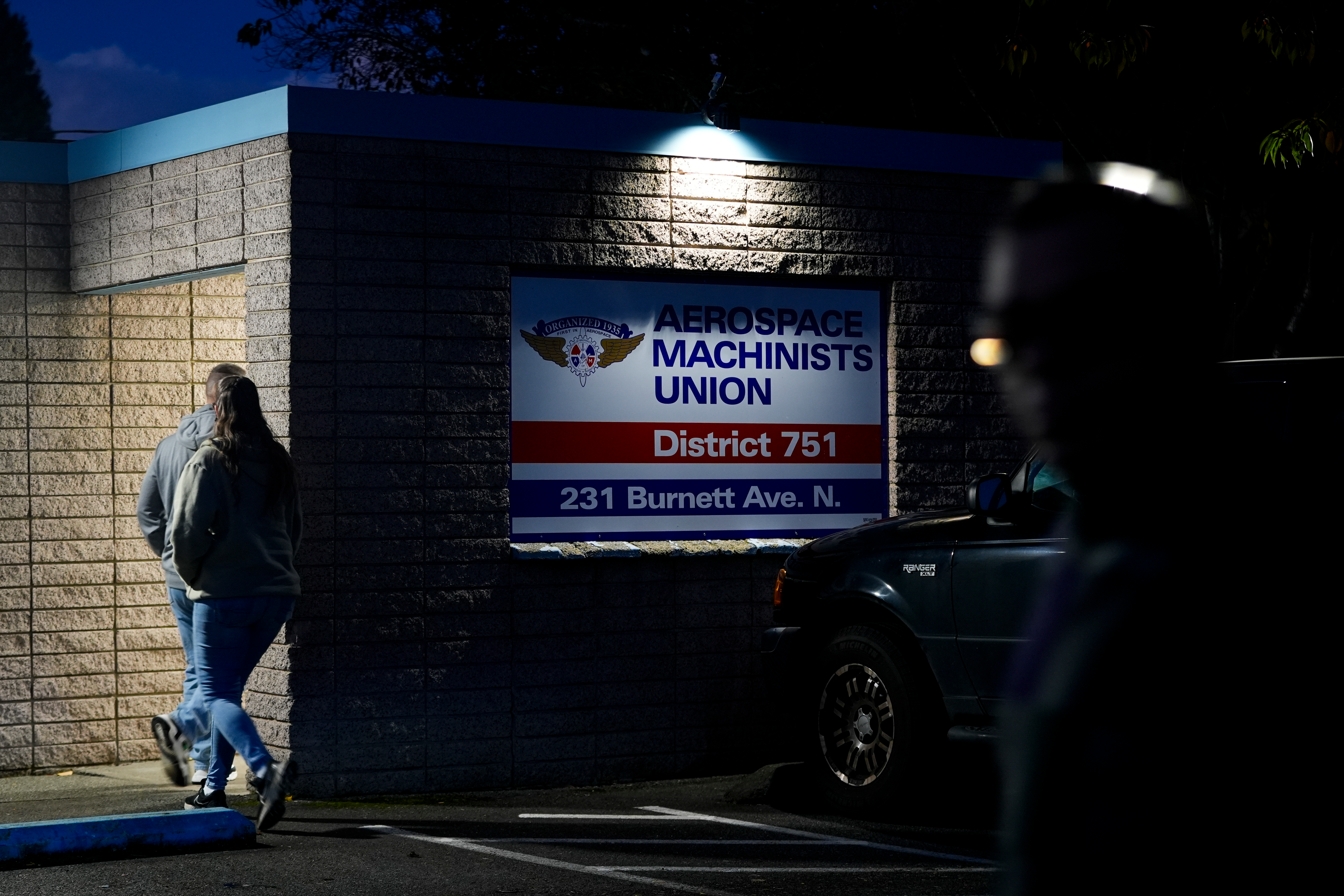 Boeing employees arrive to vote on a new contract offer from the company Monday, Nov. 4, 2024, at the Aerospace Machinists Union hall in Renton, Wash.