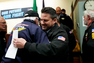 IAM District 751 president Jon Holden greets union members after announcing they voted to accept a new contract offer from Boeing, Monday, Nov. 4, 2024, at their union hall in Seattle.
