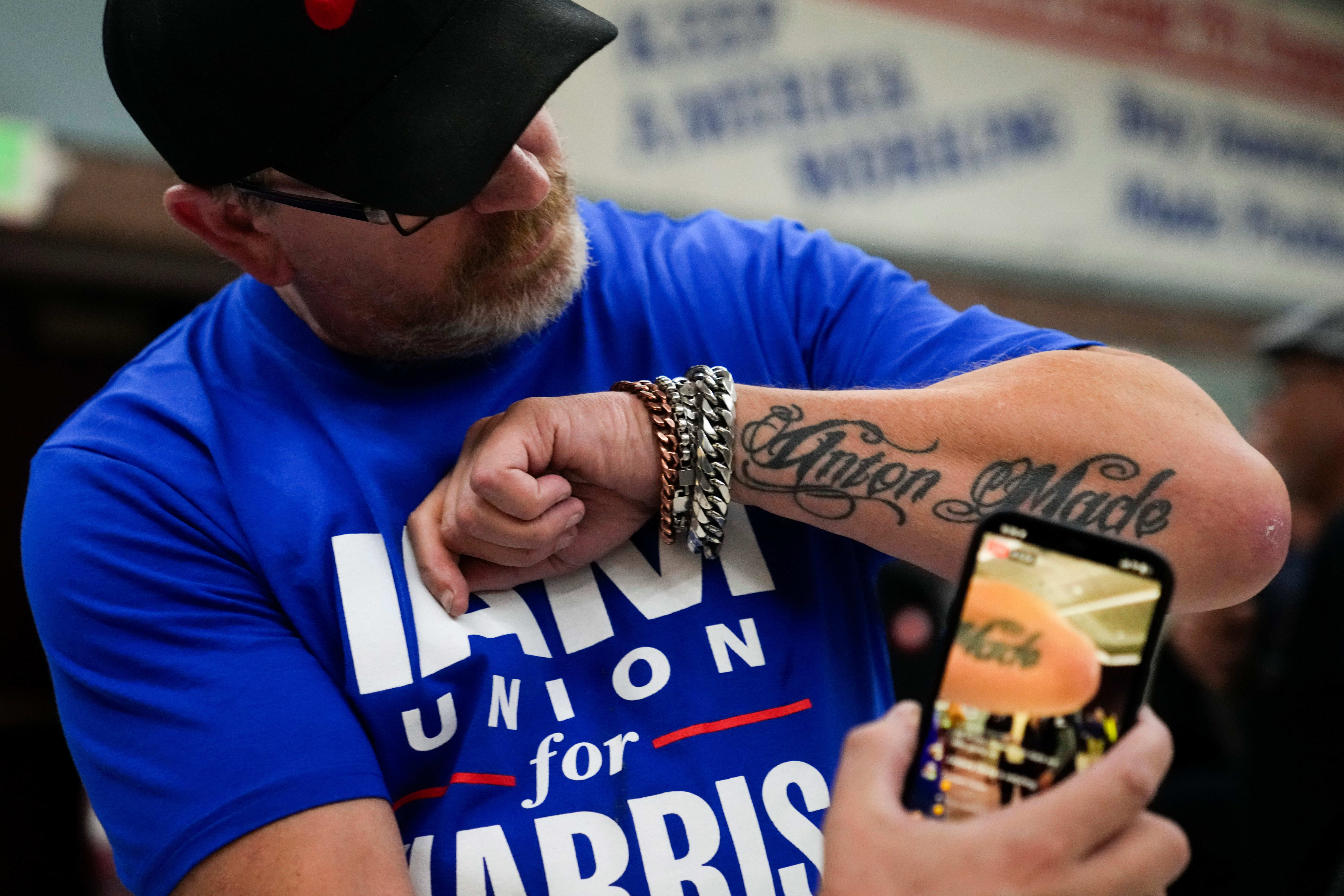 Ed Lutgen shows off his tattoo while waiting to hear the results of the union vote on a new contract offer from Boeing, Monday, Nov. 4, 2024, at IAM District 751 Union Hall in Seattle.