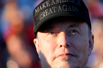 Tesla and SpaceX CEO Elon Musk listens as Republican presidential nominee former President Donald Trump speaks at a campaign event at the Butler Farm Show, Oct. 5, 2024, in Butler, Pa.