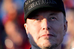 Tesla and SpaceX CEO Elon Musk listens as President Donald Trump speaks at a campaign event at the Butler Farm Show, Oct. 5, 2024, in Butler, Pa.