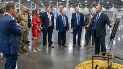 Governor Sarah Sanders joined by Senator John Boozman; Ron Cohen, President and CEO, SIG SAUER, Inc.; Maj. Gen. John T. Reim, JPEO Armaments and Ammunition; Ron Goslin, Chief Operating Officer; Robby Johnson, Chief Marketing Officer; Katelyn Wilson, VP Strategic Capture Operations; Sean McGee, Vice President, Ammunition Operations; Jason Imhoff, Chief Technology Officer, Ammunition, and Jacksonville Mayor Jeff Elmore to cut the ceremonial ribbon.
