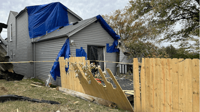 A residential fence near a Louisville, Kentucky, plant that exploded, Nov. 13, 2024.