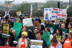 Members of Campaign for a Safe and Healthy California coalition campaign for Keep The Law (SB 1137) next to the Inglewood Oil Field in Inglewood, Calif., March. 22, 2024.