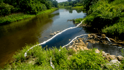 City, Genesee County and state of Michigan agencies respond to an oil spill in the Flint River, Wednesday, June 15, 2022.