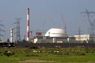 The reactor building of Iran's nuclear power plant and electricity poles are seen, at Bushehr, Iran, 750 miles (1,245 kilometers) south of the capital Tehran, Iran, Feb. 27, 2005.