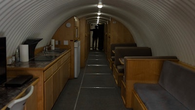 The owner, who asked not to be identified because of concerns about his privacy, turns on the lights in his underground shelter in an undisclosed Southern California city, on Dec. 16, 2024.