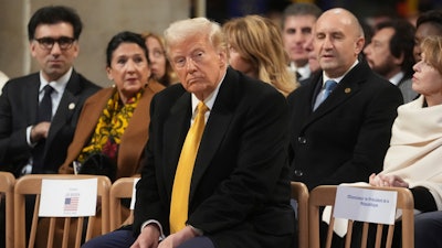 President-elect Donald Trump sits in Notre Dame Cathedral as France's iconic cathedral is formally reopening its doors for the first time since a devastating fire nearly destroyed the 861-year-old landmark in 2019, Saturday, Dec. 7, 2024 in Paris.