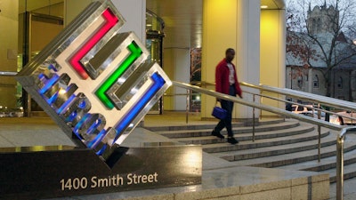 An unidentified person leaves Enron Corp. headquarters in Houston at the end of the day Jan. 22, 2002.