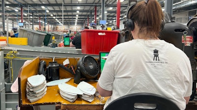 Wilson Sporting Goods football factory employee CJ Dyer makes a football for the upcoming Super Bowl matchup between the Philadelphia Eagles and the Kansas City Chiefs by using a machine that stitches the ball, Monday, January 27, 2025, in Ada, Ohio.