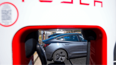 A Tesla level three Electric vehicle charger is visible, Feb. 2, 2024, in Kennesaw, Ga., near Atlanta.