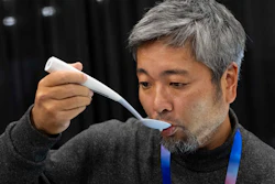 Kiyohiro Izumo uses the Kirin Electric Salt spoon which intensifies salt flavor by flowing a mild electric current through the food around the tongue to attract salt towards the tongue, during 2025 CES Unveiled, Sunday, Jan. 5, 2025, in Las Vegas.