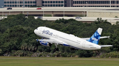 A JetBlue Airways Airbus A320-232 takes off from the Tampa International Airport in Tampa, Fla., May 15, 2014.