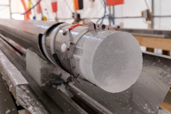 An ice core drilled by a research team is displayed at Little Dome C field base in eastern Antarctica, during the cutting phase on Tuesday, Jan. 7, 2025.