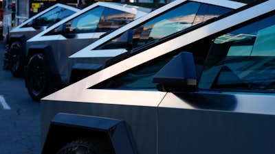 Tesla Cybertrucks are displayed at the AutoMobility LA Auto Show, Nov. 21, 2024, in Los Angeles.