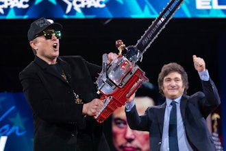 Elon Musk, left, receives a chainsaw from Argentina's President Javier Milei as they arrive speaks at the Conservative Political Action Conference, CPAC, at the Gaylord National Resort & Convention Center, Thursday, Feb. 20, 2025, in Oxon Hill, Md.