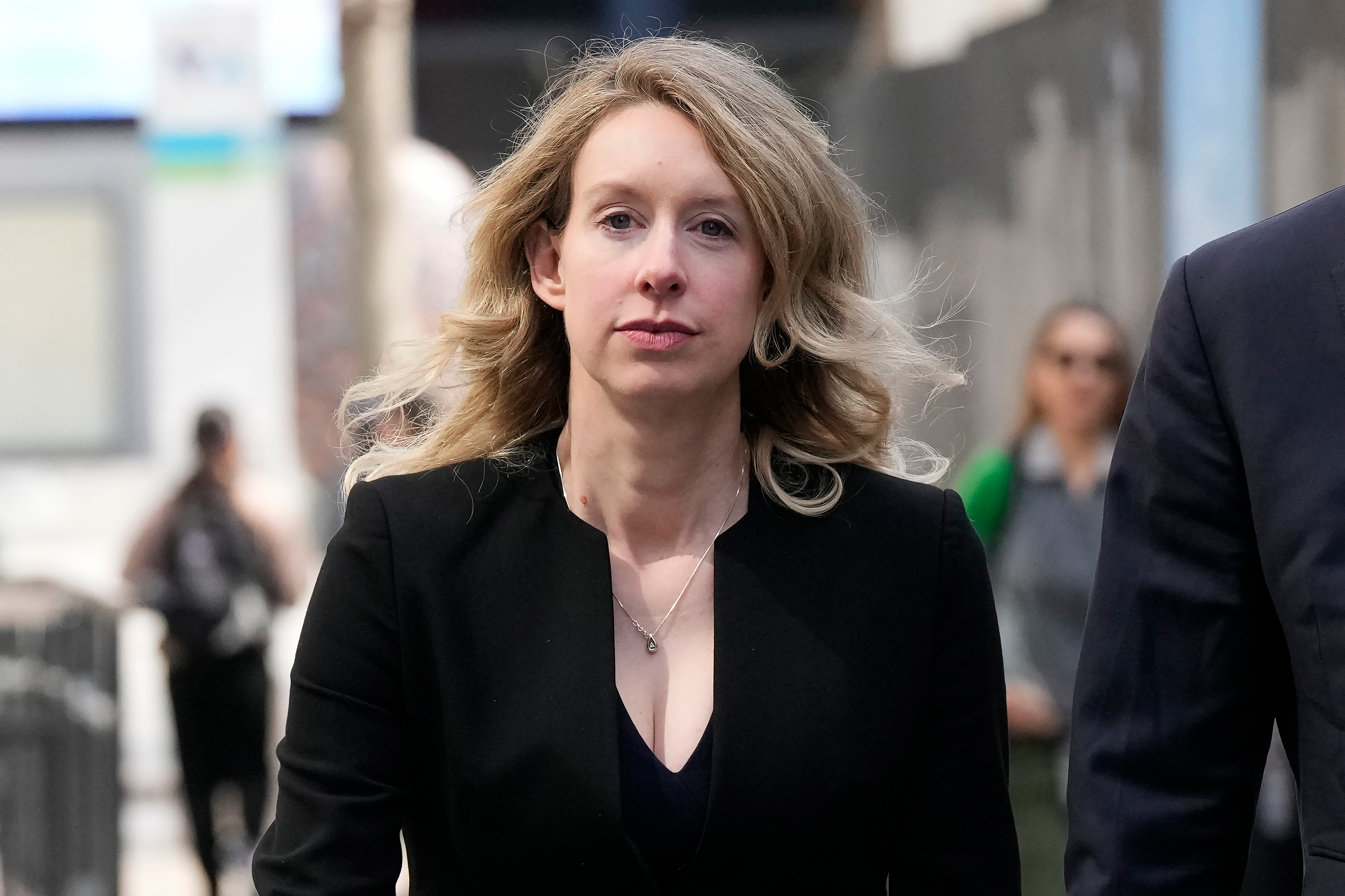 Former Theranos CEO Elizabeth Holmes leaves federal court in San Jose, Calif., March 17, 2023.
