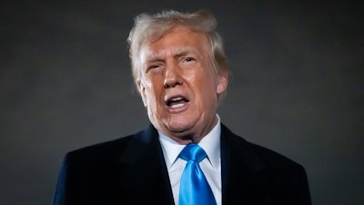 President Donald Trump speaks to reporters next to Air Force One after arriving back at Joint Base Andrews, Md., Sunday, Feb. 2, 2025.
