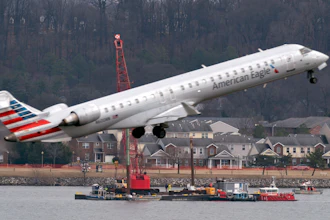 Salvage crews work on recovering wreckage near the site in the Potomac River of a mid-air collision between an American Airlines jet and a Black Hawk helicopter at Ronald Reagan Washington National Airport, Thursday, Feb. 6, 2025, in Arlington, Va.